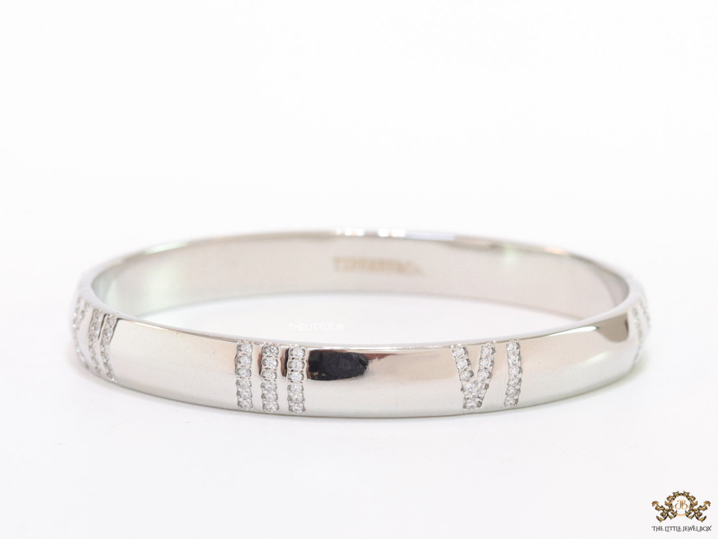 Platinum plated bracelet with cz roman numerals