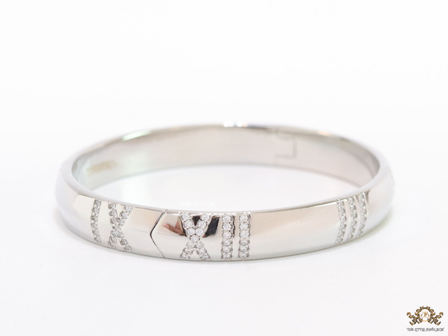 Platinum plated bracelet with cz roman numerals