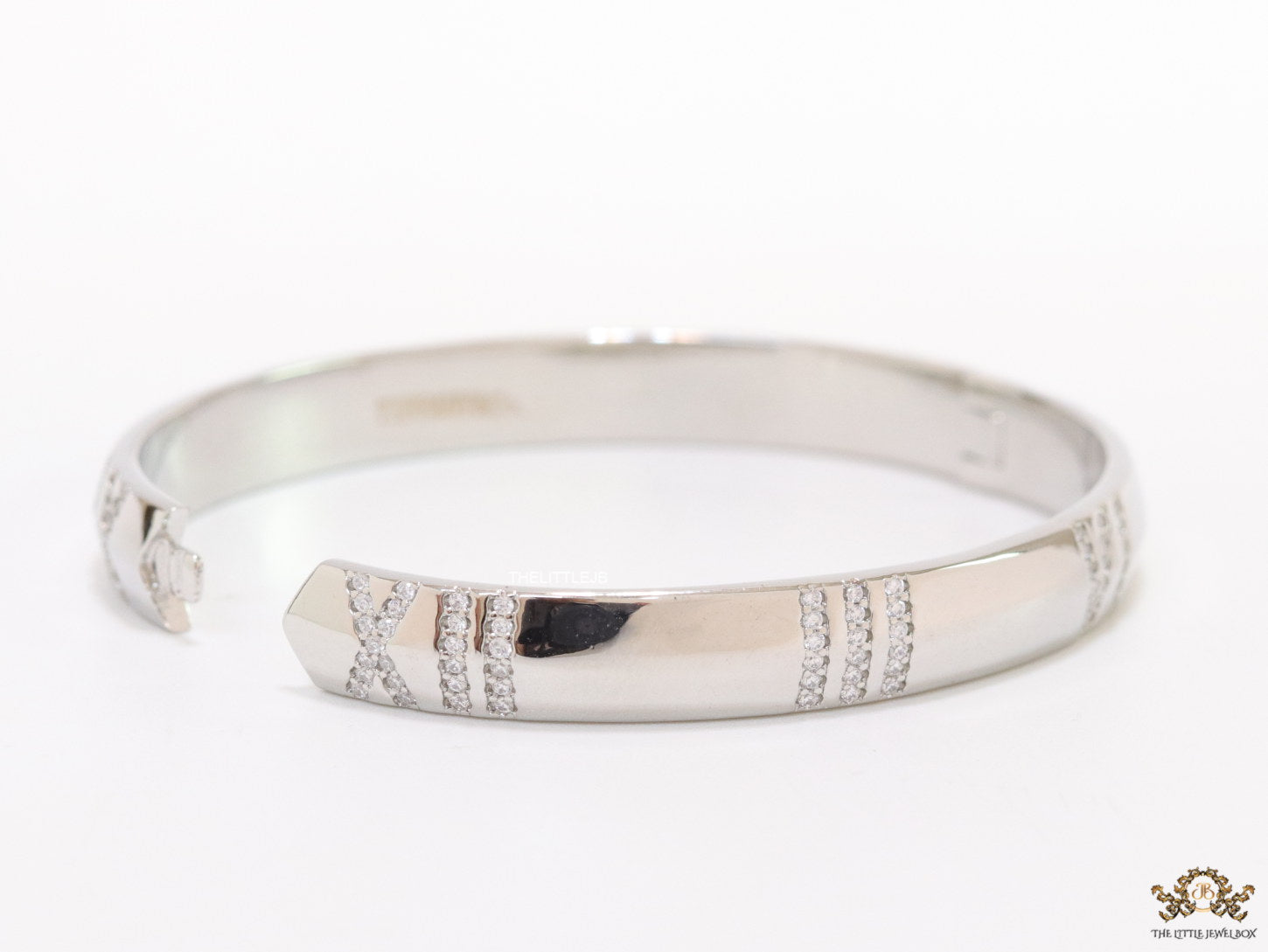 Platinum plated bracelet with cz roman numerals