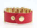 Alphabet M red colour bracelet in gold finish