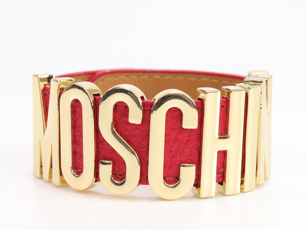 Alphabet M red colour bracelet in gold finish