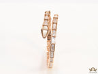Open top rose gold plated minimal serpentine bracelet with cubic zirconia stones and pearl white stones.