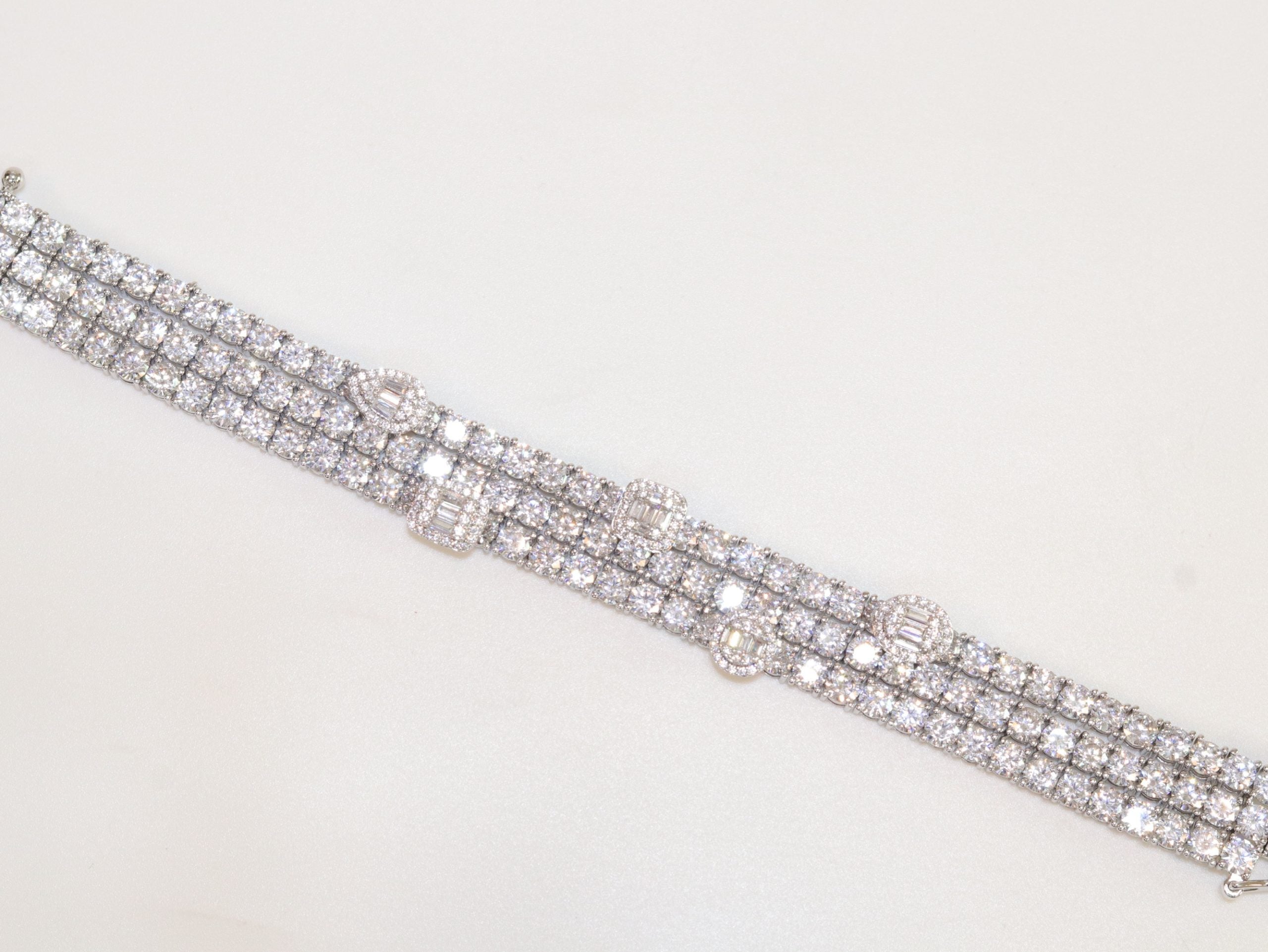 Triple Stacked multiple cut CZ bracelet in platinum finish