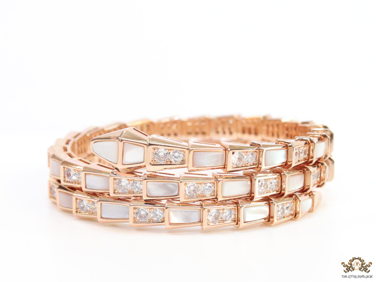 Triple line rose gold plated minimal snake bracelet with cubic zirconia stones and pearl white stones.