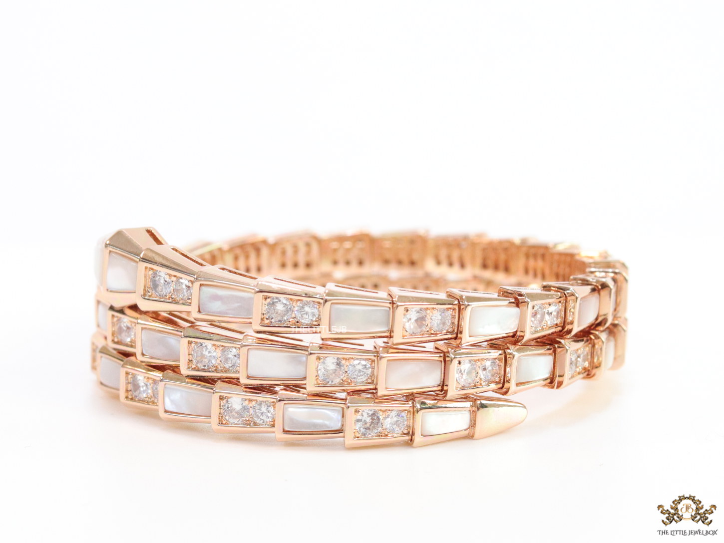 Triple line rose gold plated minimal snake bracelet with cubic zirconia stones and pearl white stones.