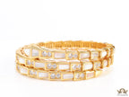 Triple line gold plated minimal serpentine bracelet with cubic zirconia stones and pearl white stones.