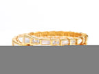Triple line gold plated minimal snake bracelet with cubic zirconia stones and pearl white stones.