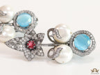 Cz flower earrings with shell pearls and light blue stones