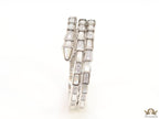 Triple line platinum plated minimal serpentine bracelet with cubic zirconia stones and pearl white stones.
