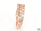 Triple line rose gold plated minimal serpentine bracelet with cubic zirconia stones and pearl white stones.