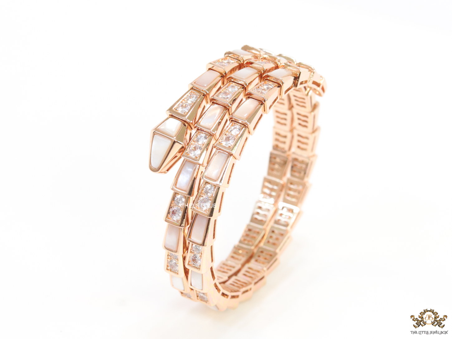 Triple line rose gold plated minimal snake bracelet with cubic zirconia stones and pearl white stones.