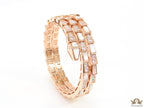 Triple line rose gold plated minimal serpentine bracelet with cubic zirconia stones and pearl white stones.