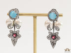 Cz flower earrings with shell pearls and light blue stones