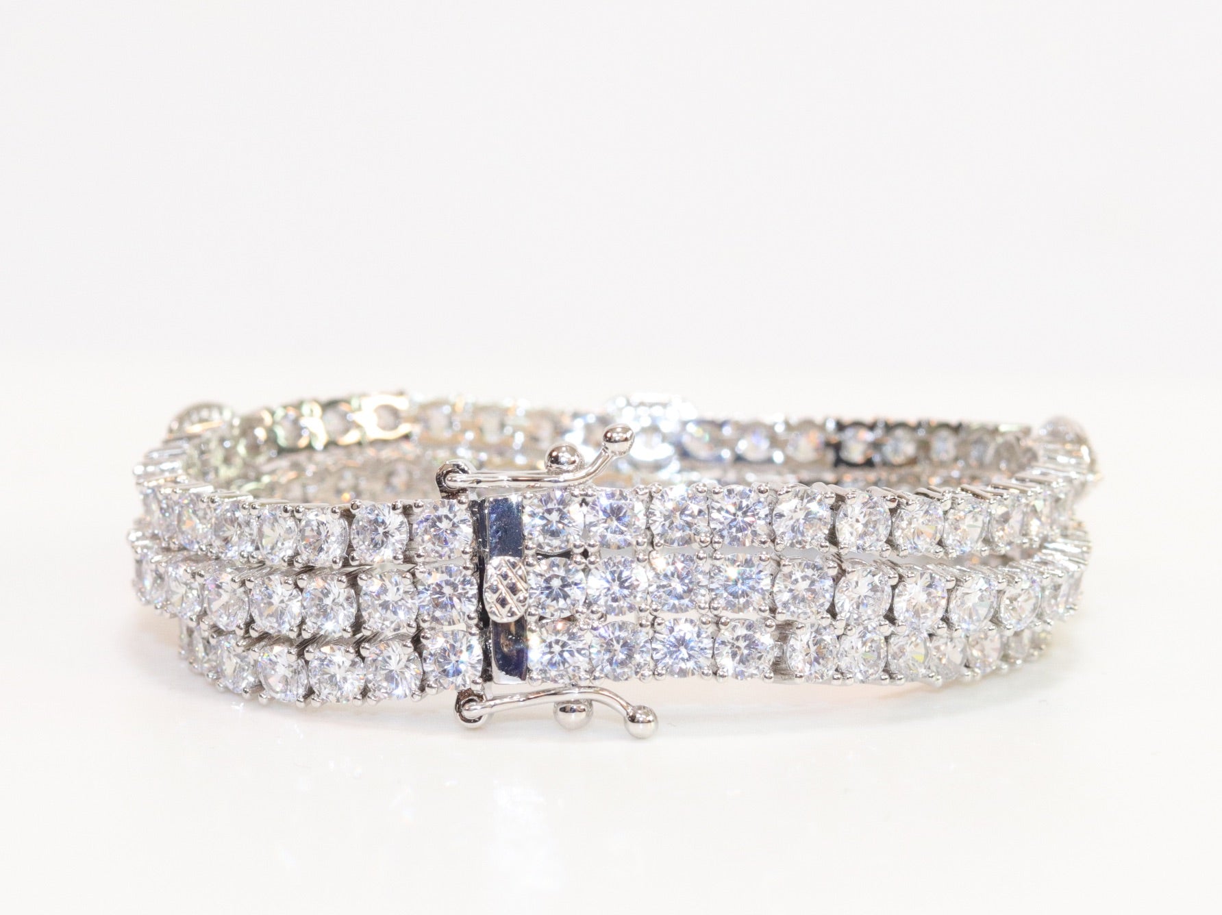Triple Stacked multiple cut CZ bracelet in platinum finish