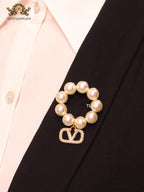 Alphabet V off white pearl and gold brooch