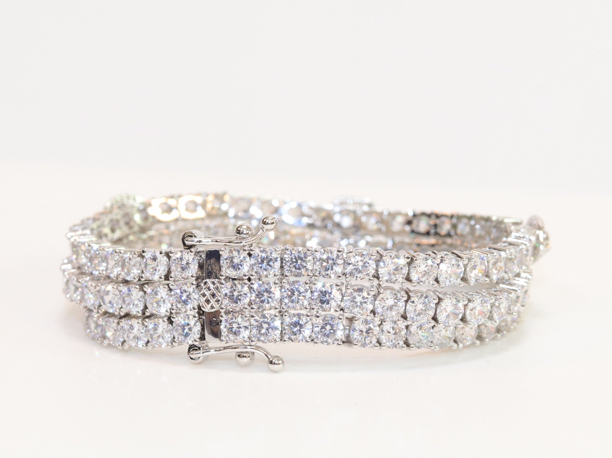 Triple Stacked multiple cut CZ bracelet in platinum finish