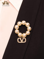 Alphabet V off white pearl and gold brooch