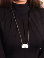 Double C enamel Bag on a black and gold chain