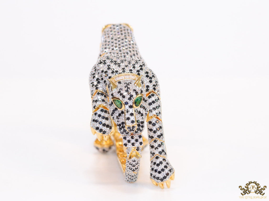 Cubic zirconia stone studded panther motif with emerald green colour stone details gold plated bracelet