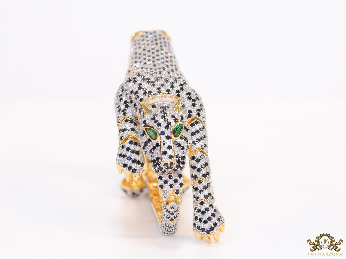 Cubic zirconia stone studded panther motif with emerald green colour stone details gold plated bracelet