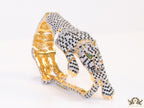 Cubic zirconia stone studded panther motif with emerald green colour stone details gold plated bracelet