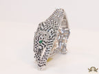 Cubic zirconia stone studded panther motif with emerald green colour stone details platinum plated bracelet