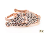 Cubic zirconia stone studded panther motif with emerald green colour stone details rose gold plated bracelet
