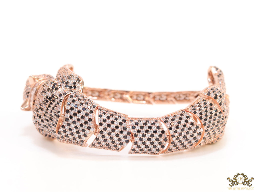 Cubic zirconia stone studded panther motif with emerald green colour stone details rose gold plated bracelet