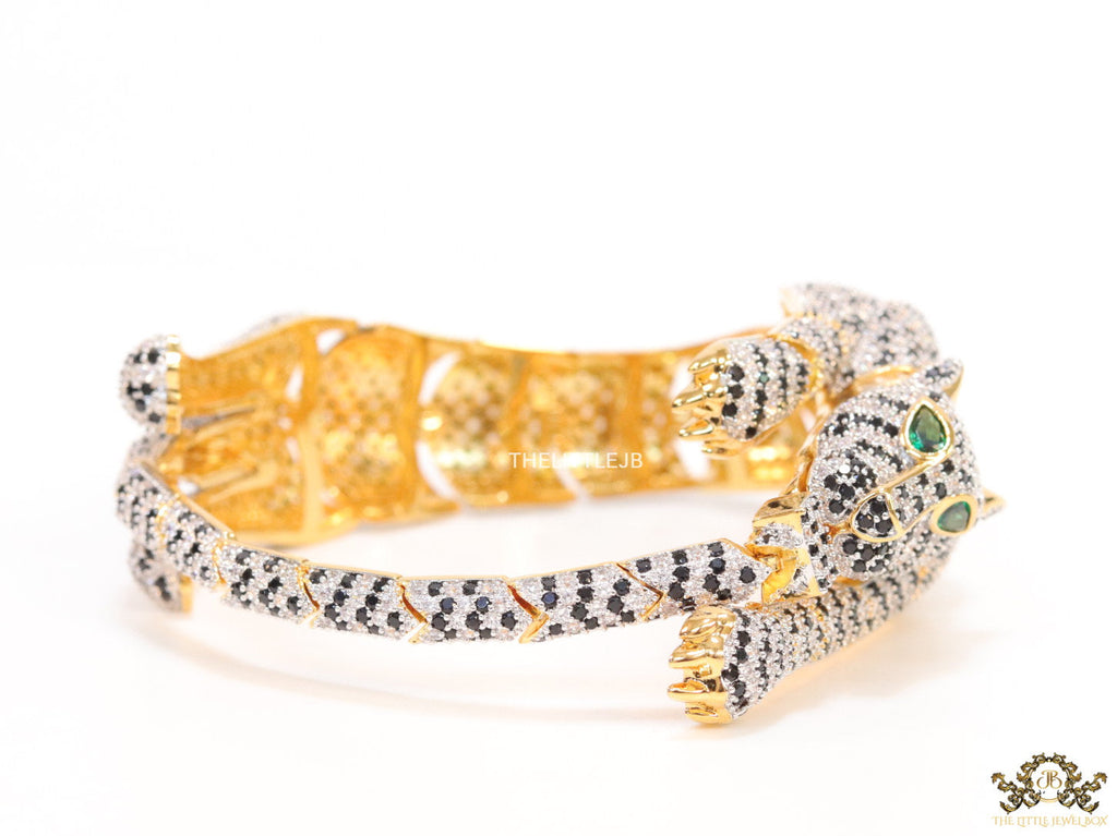 Cubic zirconia stone studded panther motif with emerald green colour stone details gold plated bracelet