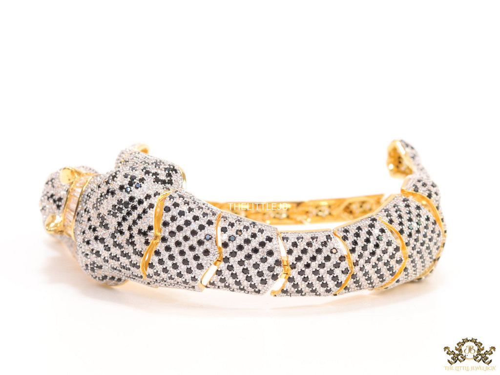 Cubic zirconia stone studded panther motif with emerald green colour stone details gold plated bracelet