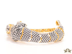 Cubic zirconia stone studded panther motif with emerald green colour stone details gold plated bracelet