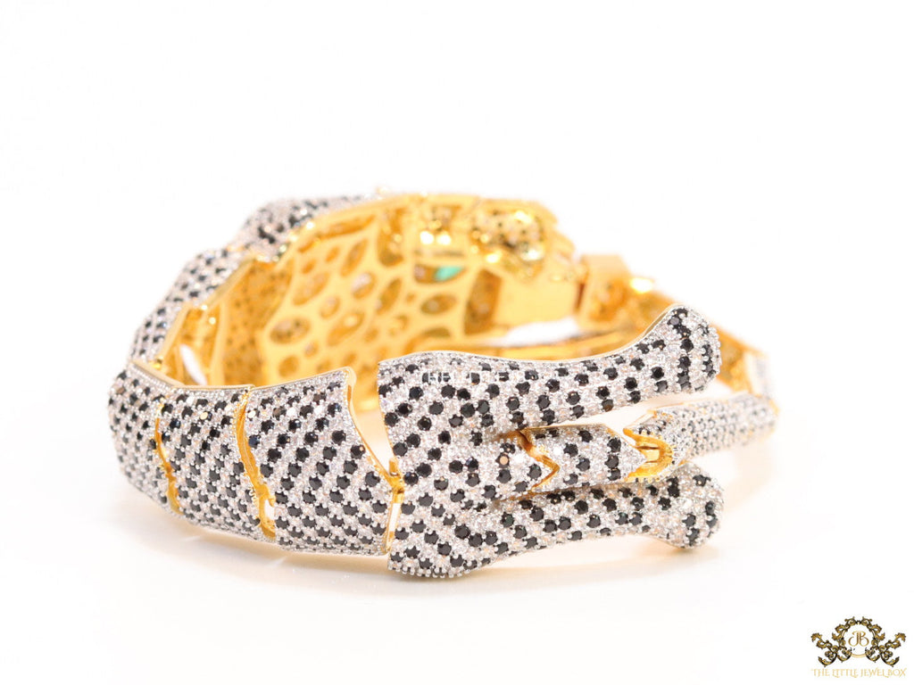 Cubic zirconia stone studded panther motif with emerald green colour stone details gold plated bracelet