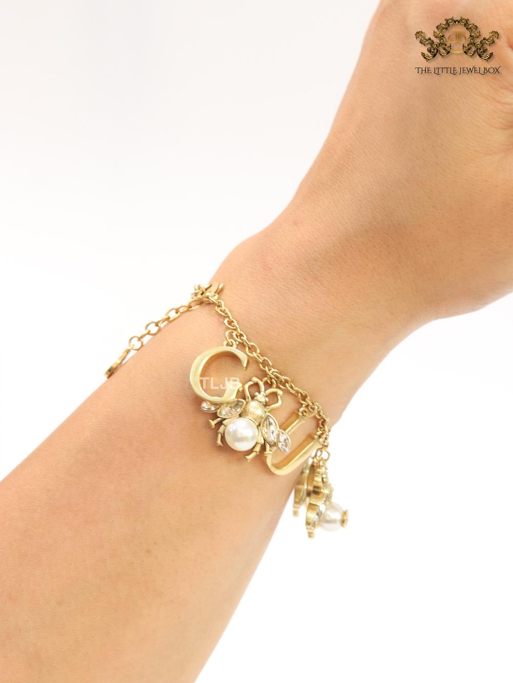 Double G bracelet with rustic charms bracelet