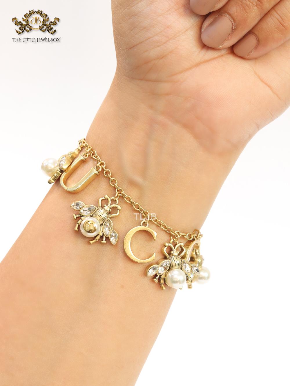 Double G bracelet with rustic charms bracelet