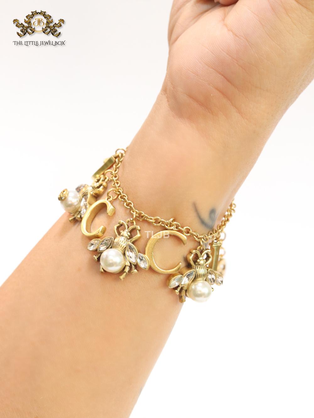 Double G bracelet with rustic charms bracelet