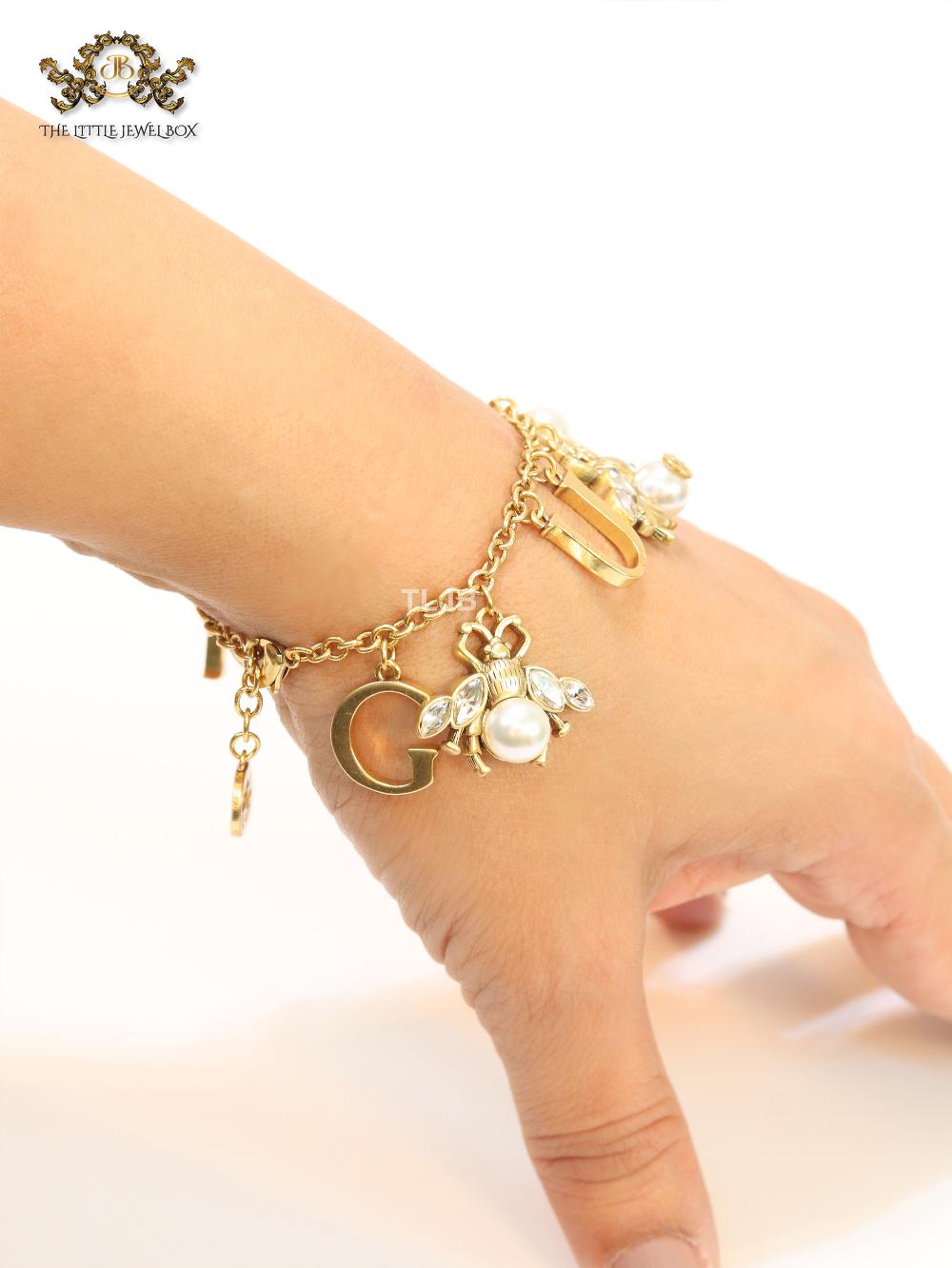 Double G bracelet with rustic charms bracelet