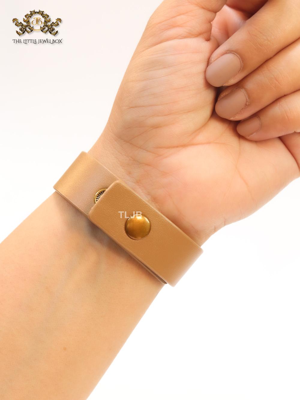 Alphabet D and tan belted bracelet