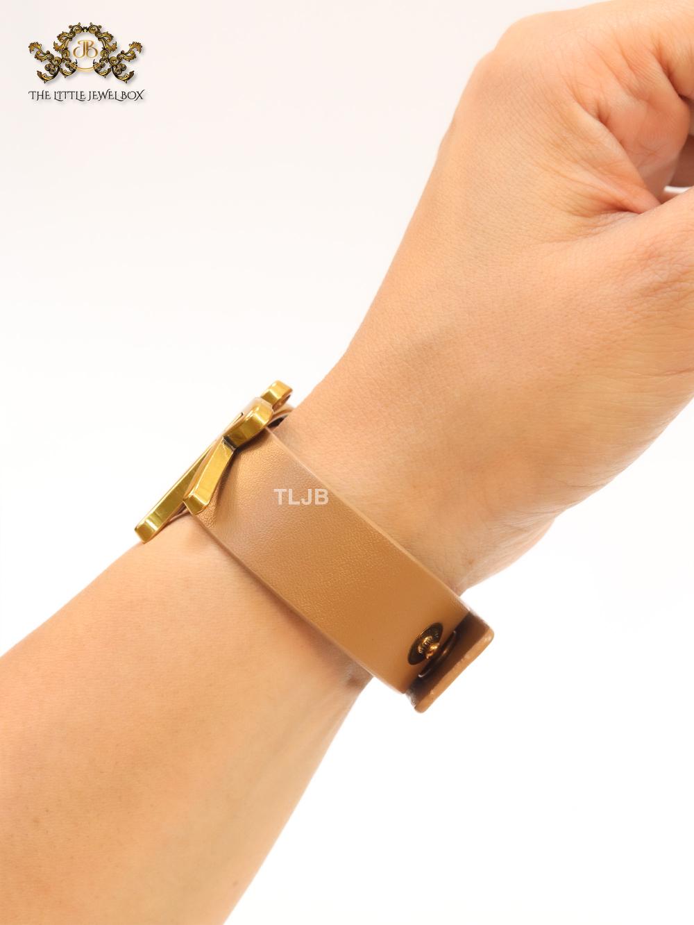 Alphabet D and tan belted bracelet