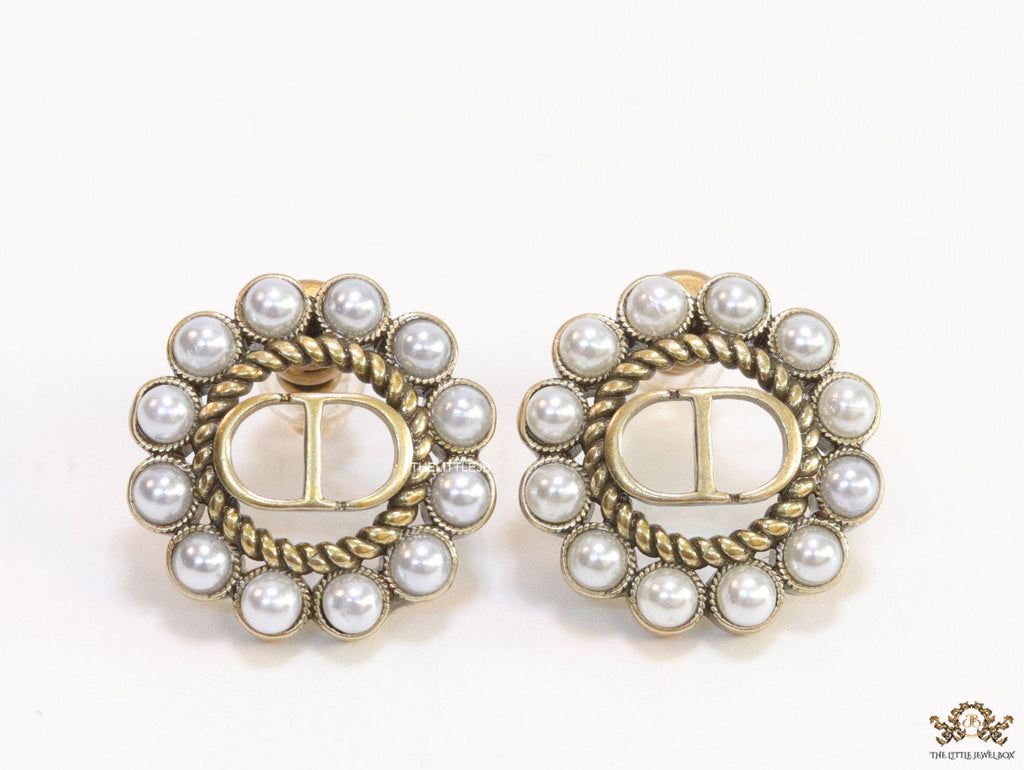 Gold plated round stud earrings with pearl lining and alphabets