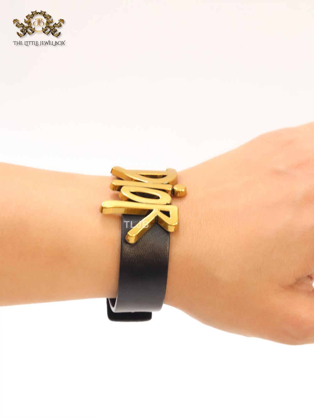Alphabet D and black belted bracelet