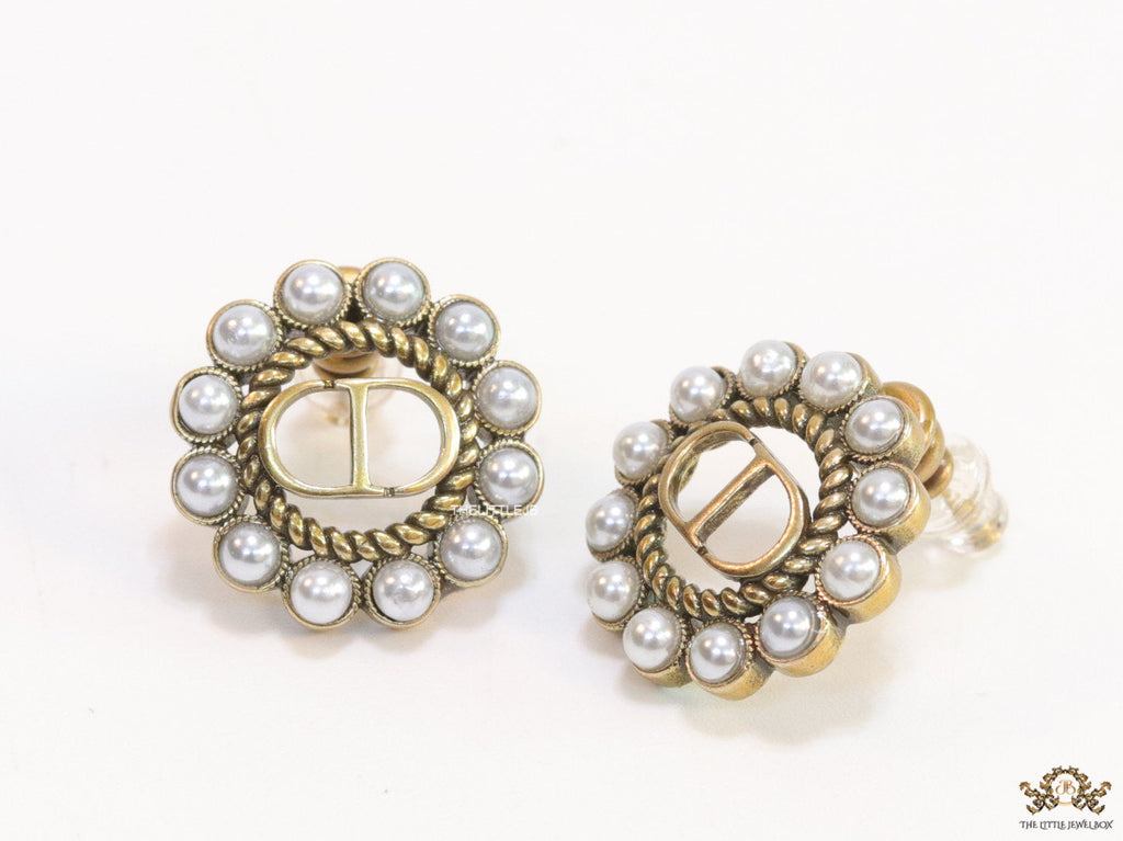 Gold plated round stud earrings with pearl lining and alphabets