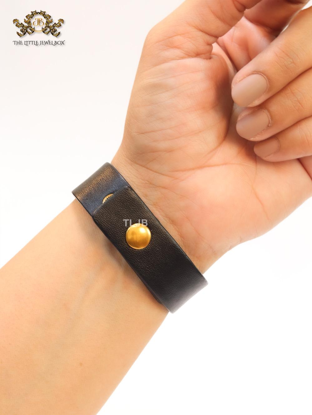 Alphabet D and black belted bracelet