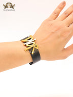 Alphabet D and black belted bracelet