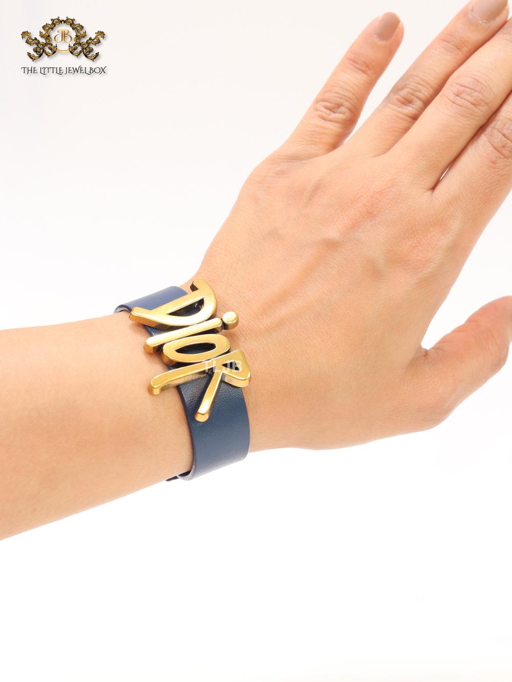 Alphabet D and blue belted bracelet