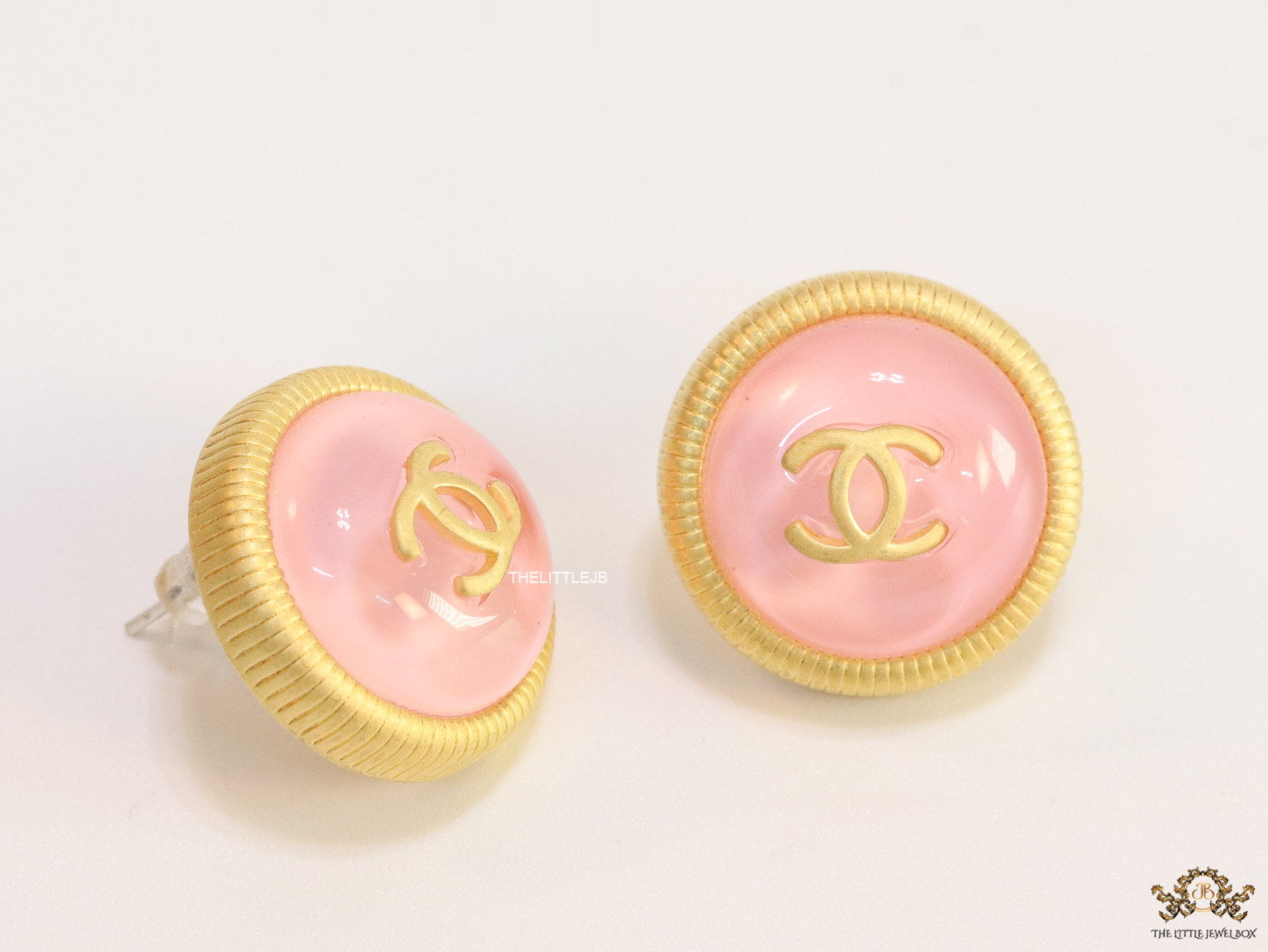 Pink and golden round studs with twin C motif