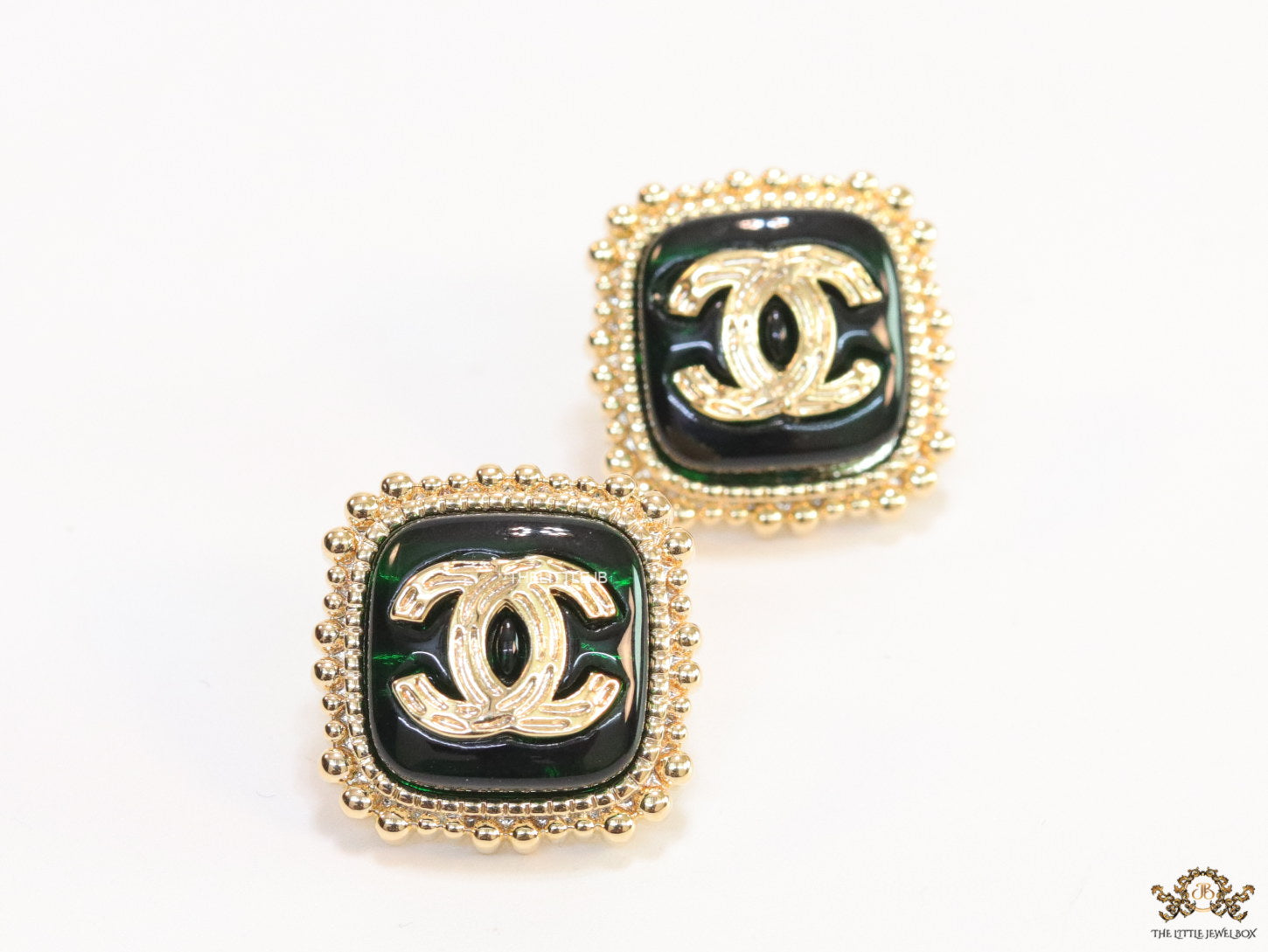 Square deep green and golden stud earrings with golden twin C motifs