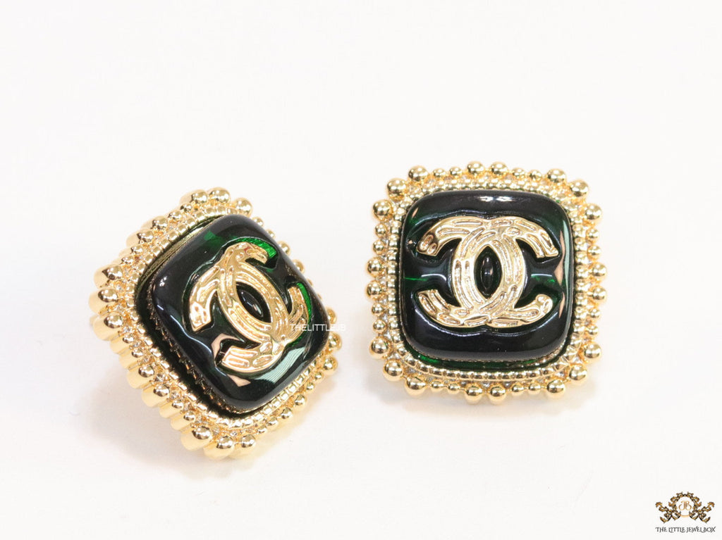Square deep green and golden stud earrings with golden twin C motifs