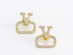 Alphabet V cz studs in gold finish