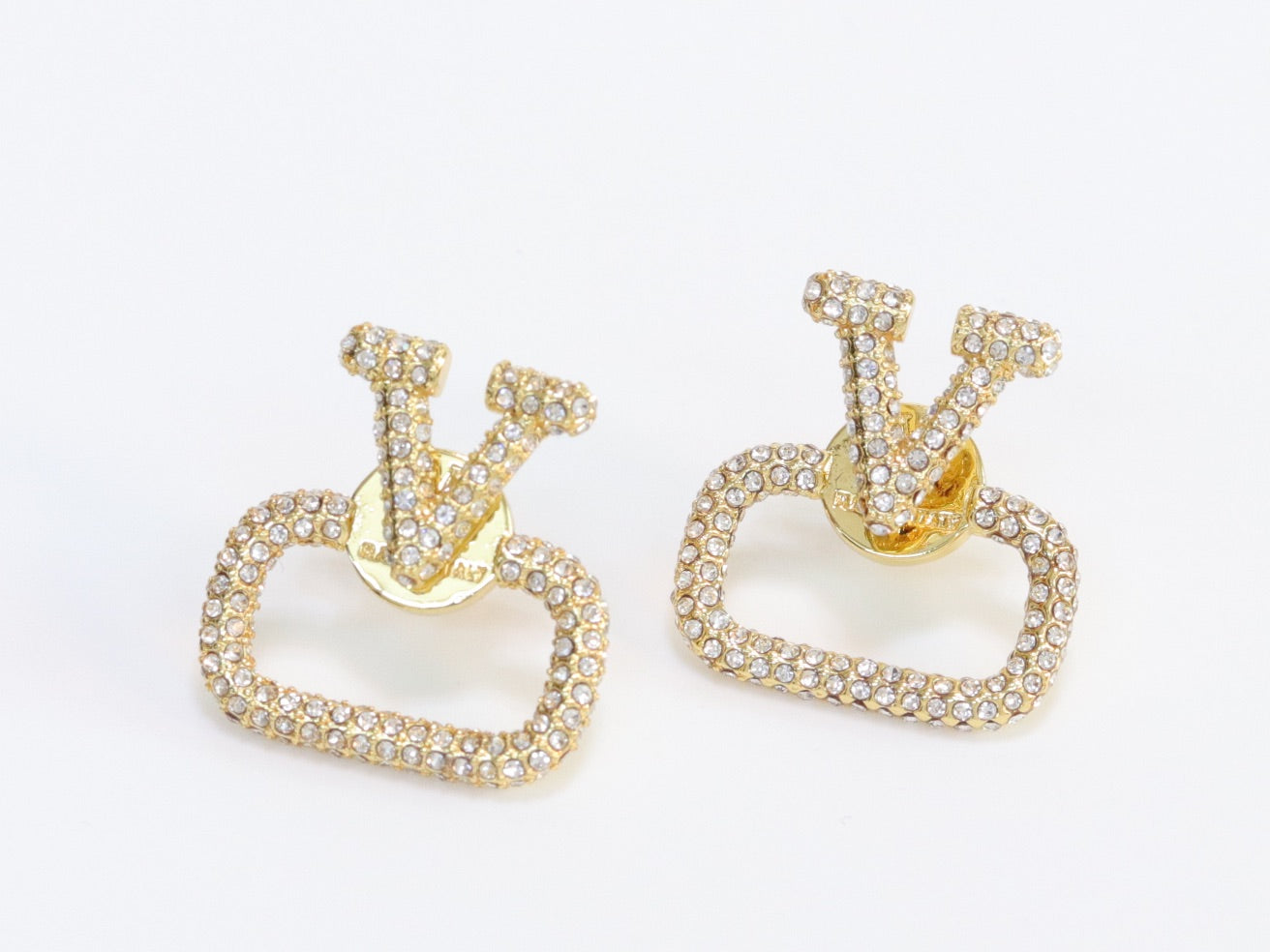 Alphabet V cz studs in gold finish