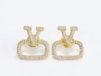 Alphabet V cz studs in gold finish